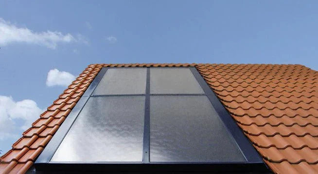 Flat-plate collector VITOSOL 200-FM Solarpanel installed on red tiled roof under blue sky