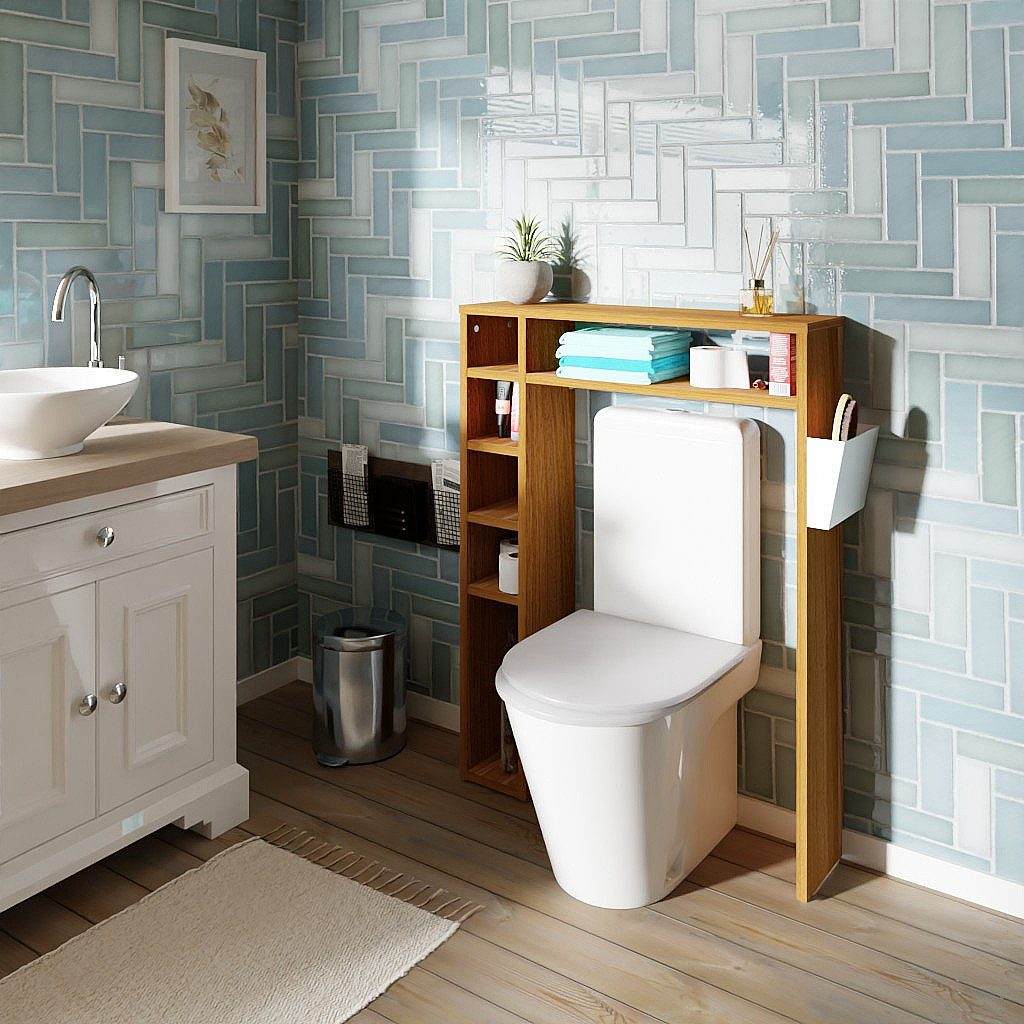 Compact white oak bathroom storage shelf with multiple compartments placed over toilet for toiletries and towels organization