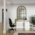 Modern Aure Desk in oak and white finish with drawers, styled in a minimalist home office setting with black ergonomic chair and decorative mirror.