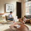 Daikin MC80Z air purifier in modern living room with woman and child, compact design for large spaces, Wi-Fi control, electrostatic HEPA filter, ultra-quiet operation