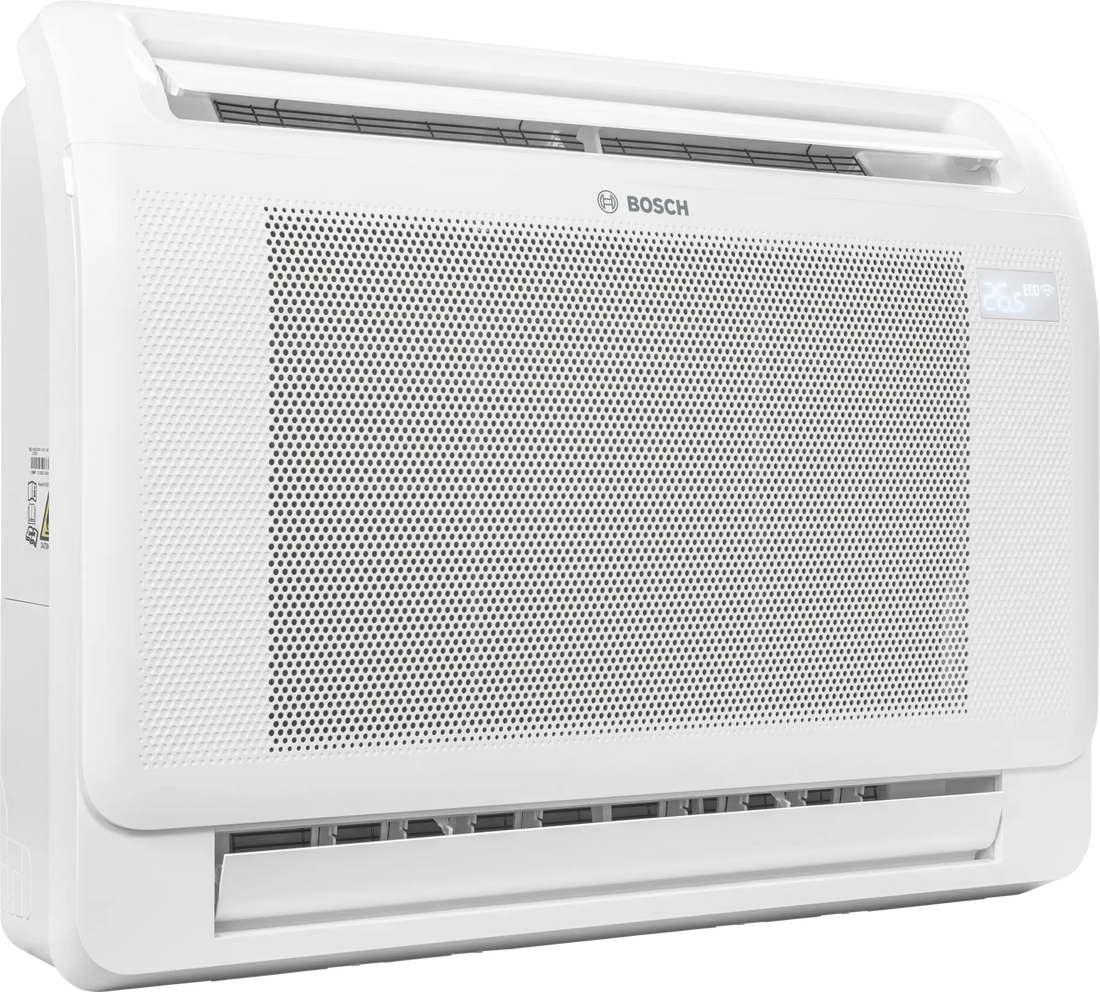 Bosch Climate 5000i M indoor console air conditioner unit with compact white design, digital display, and dual air outlets for efficient cooling and heating.