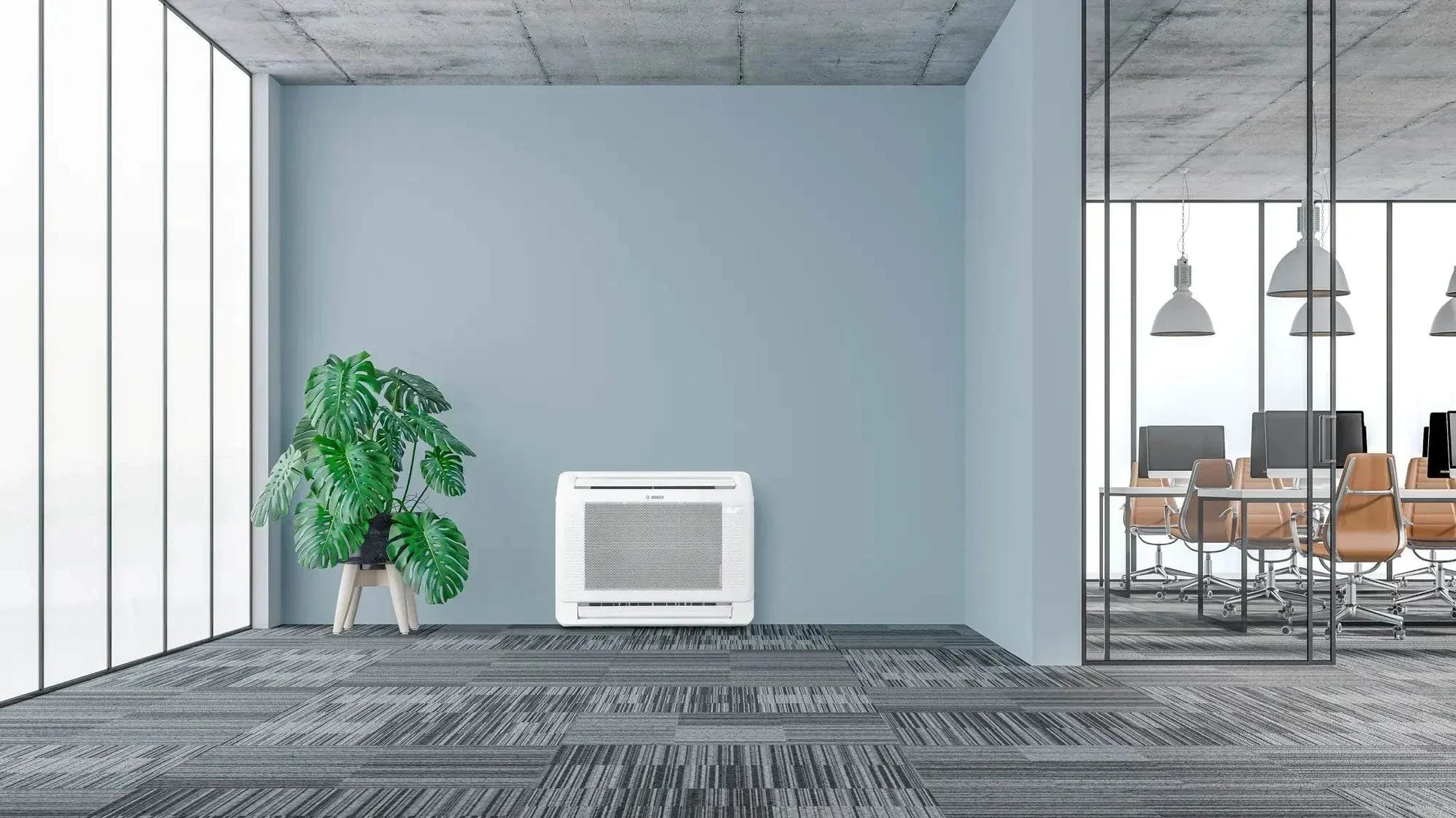 Bosch Climate 5000i M compact indoor console air conditioner unit in modern office space