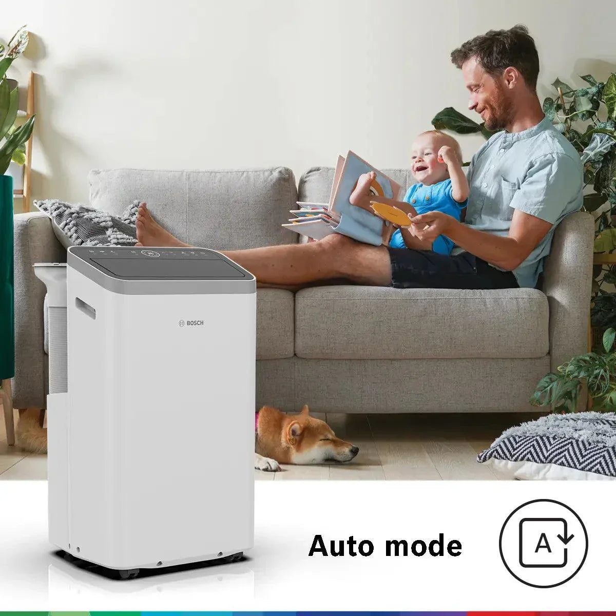 Bosch Cool 5000 mobile air conditioner in a living room with a man and child, showcasing auto mode and sleek, compact design.